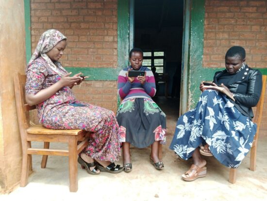 three persons sitting down at the porch