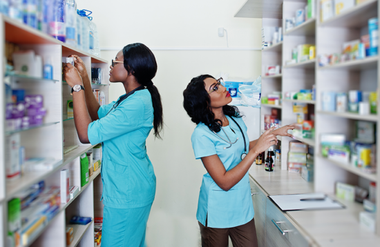 Two people working in a hospital pharmacy