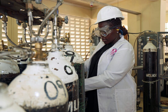 Person inspecting the oxygen containers