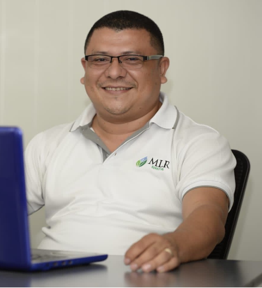 A person sitting behind a laptop